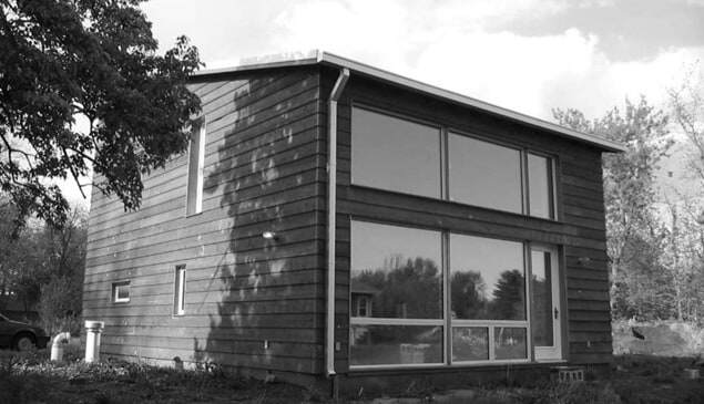 Casa con ventanas fotovoltaicas